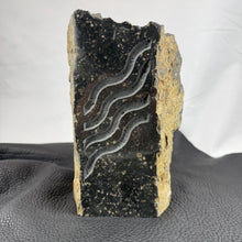 Pacific Northwest Basalt Column with Sand-Carved Parallel Wavy Lines