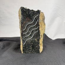 Pacific Northwest Basalt Column with Sand-Carved Parallel Wavy Lines