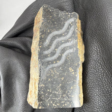 Pacific Northwest Basalt Column with Sand-Carved Parallel Wavy Lines