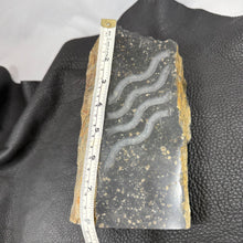 Pacific Northwest Basalt Column with Sand-Carved Parallel Wavy Lines